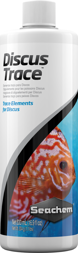 A close-up image of the Seachem Discus Trace 500 mL bottle. The bottle features a detailed design with a prominent discus fish graphic and product labeling for trace element replenishment in discus aquariums.